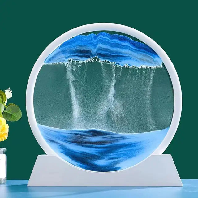 Circular water display with a waterfall design on a stand against a green background